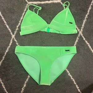 like green triangl swim suit. size small.